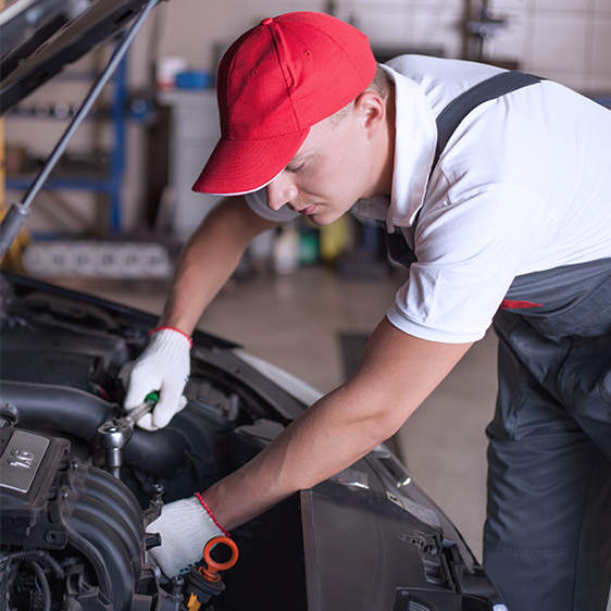 Mechanic performing auto transmission repair